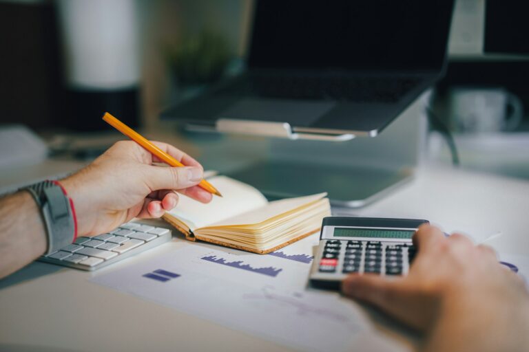 A business owner working through payroll compliance manually
